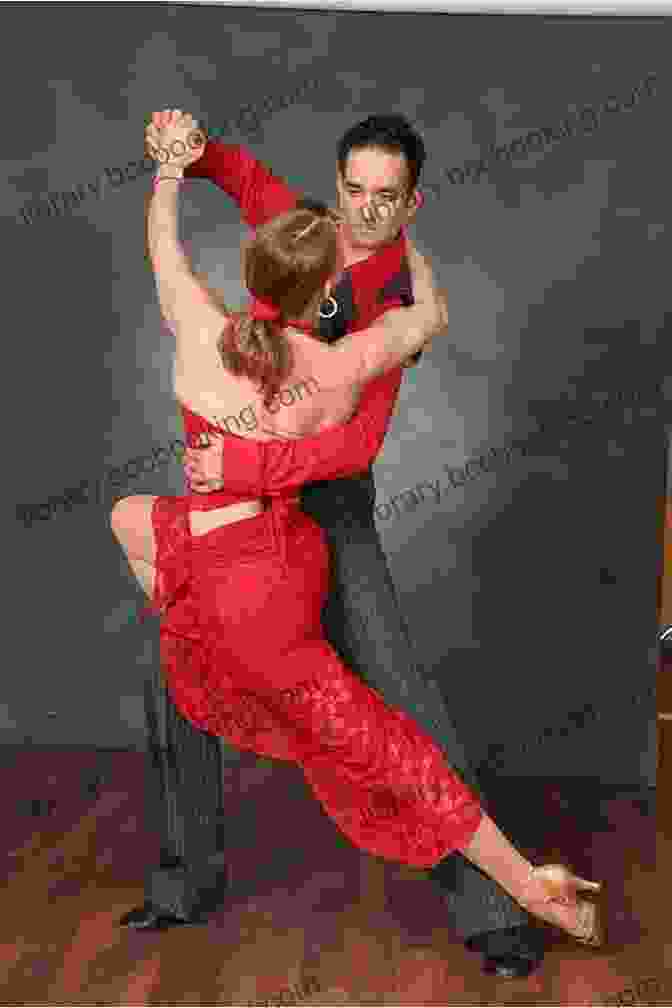 A Passionate Tango Couple Dancing On A Dimly Lit Dance Floor. Musicality For Social Dancing: Filling In The Blanks Of Argentine Tango