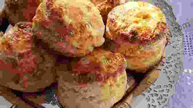 A Plate Of Flaky And Golden Brown Biscuits, Ready To Be Enjoyed With Butter Or Your Favorite Gravy. Savory Quick Breads: Muffins Quick Breads Cornbreads Biscuits (Southern Cooking Recipes)