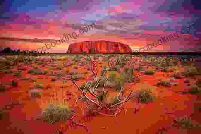 A Stunning Landscape Of The Australian Outback, Featuring Rugged Red Rock Formations, Vast Plains, And A Clear Blue Sky. Outback Adventures: Tales From The Top End And Beyond